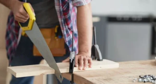 Sawing a wooden board